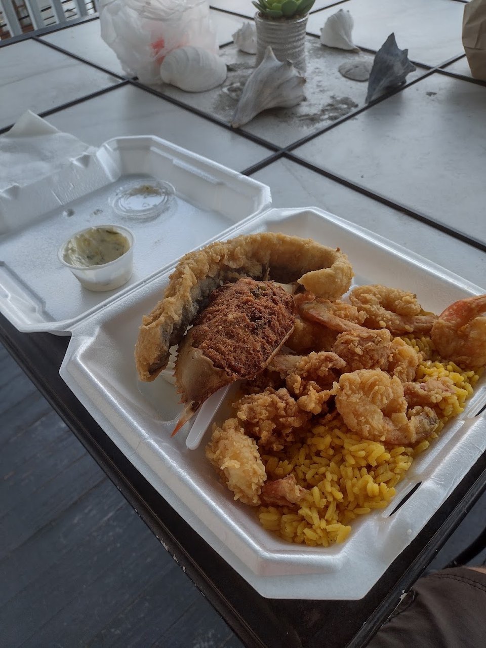 Takeout menu showing rice, greens, and rib plates.